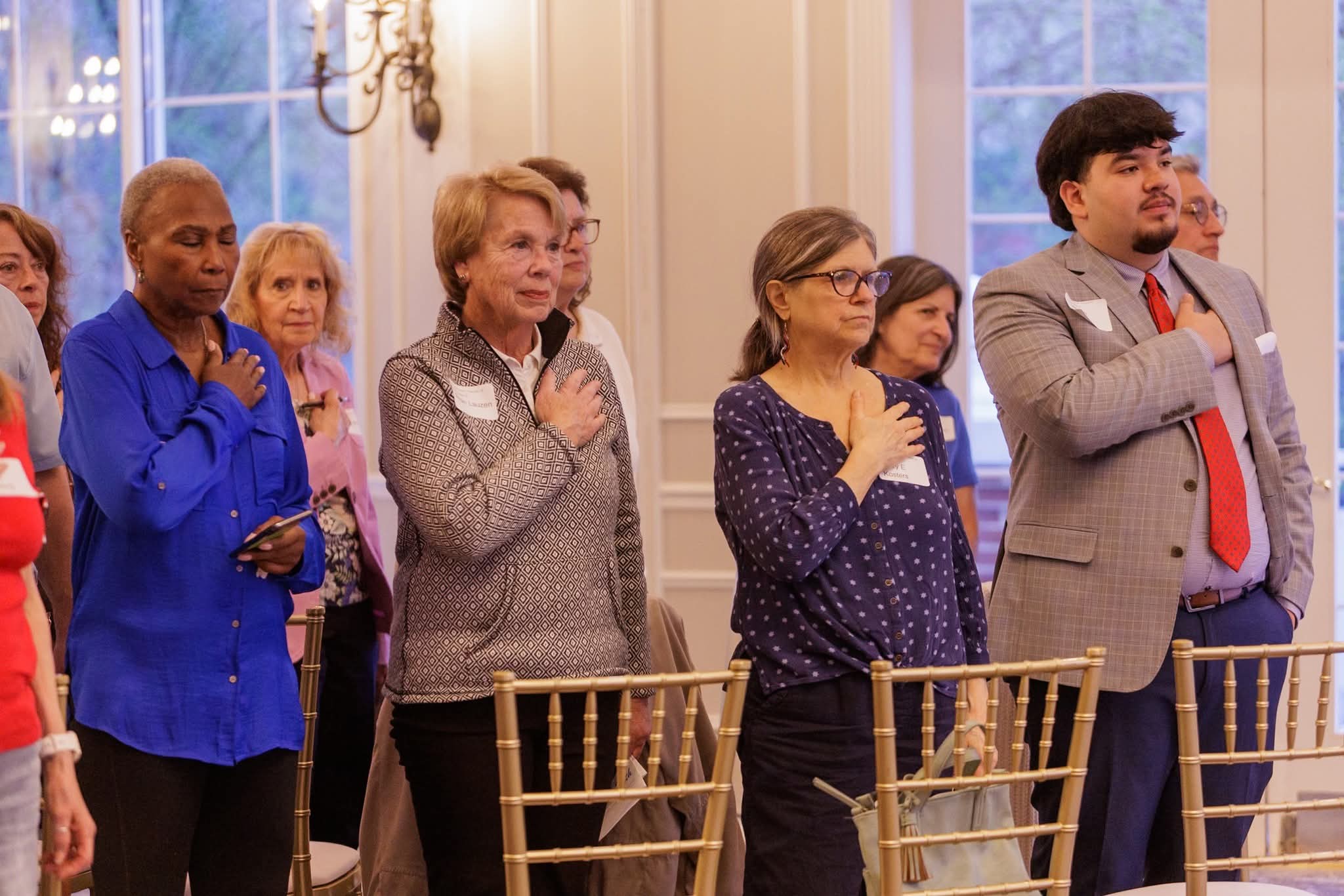 Kane GOP attendees standing for the Pledge of Allegiance